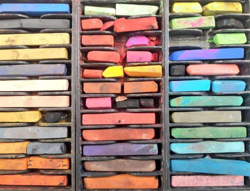 Coloured blocks of pastels in a compartmented box